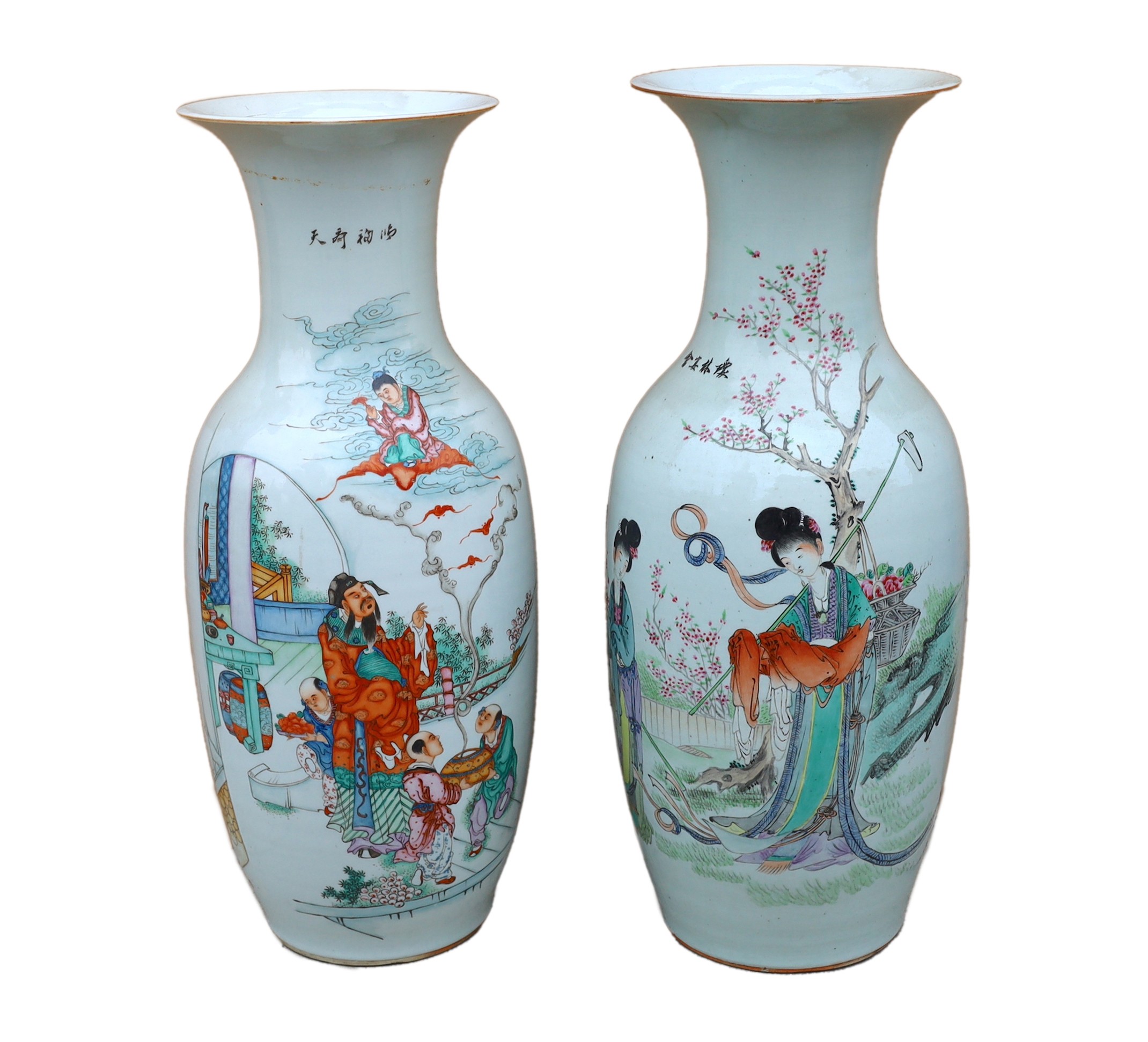 A pair of Japanese polychrome decorated porcelain baluster vases decorated with figures in gardens, height 57cm